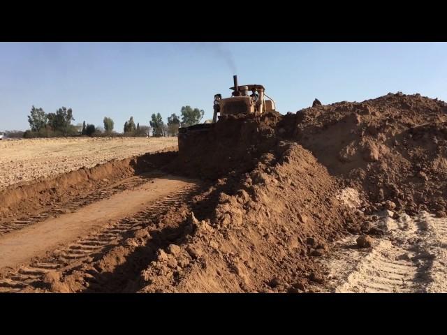 Old CAT pushing huge pile of dirt!!!