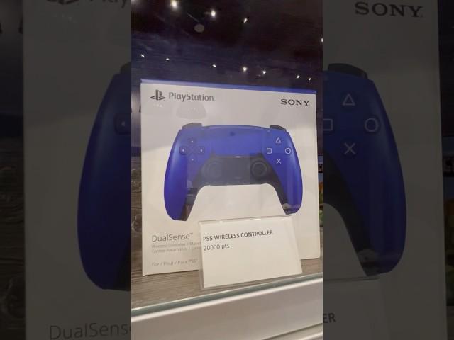 The Google Chromecast with Google TV and a blue PlayStation five controller at the arcade ￼￼￼