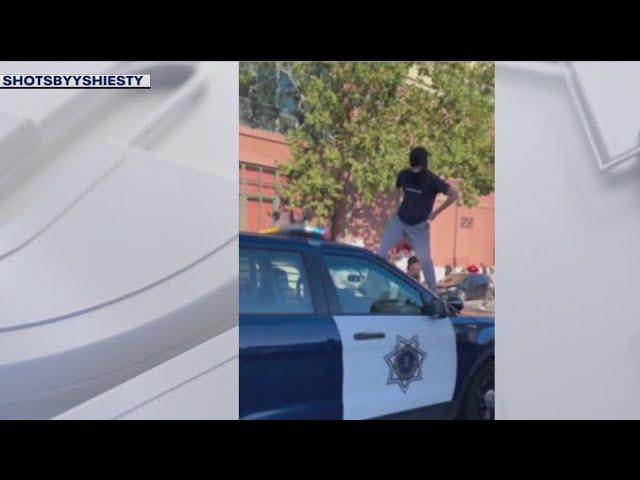 Masked spectators stomp, attack San Jose police car after sideshow | KTVU