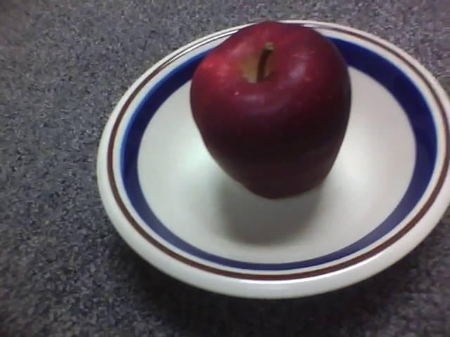 Brer Gator nibbles an apple while listening to "Marathi Balgeet: ABCD Alphabets"