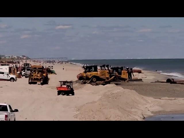 Sand machine and pipe being installed at Carolina Beach @mlodata