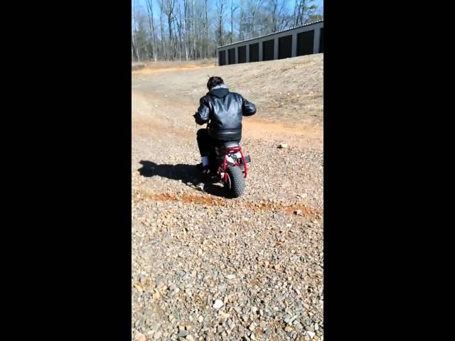 My brother Forest's minibike throwing dirt.