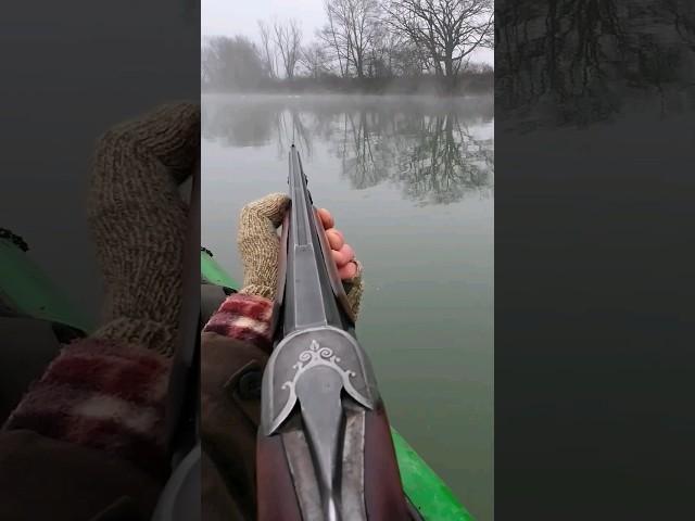 Duck hunting with a beautiful over/under from a canoe