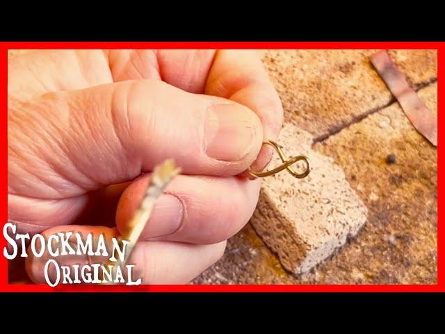 Soldering a hanger for Sacagawea carving