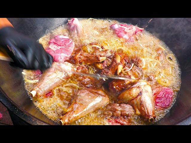 Chef prepares meaty Street Food in large Wood Oven | Street Food Berlin Germany