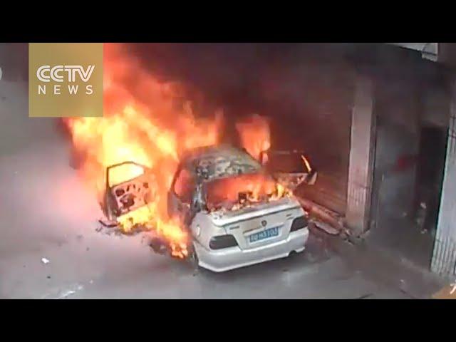 Two boys throw firecrackers into a car, burn it down