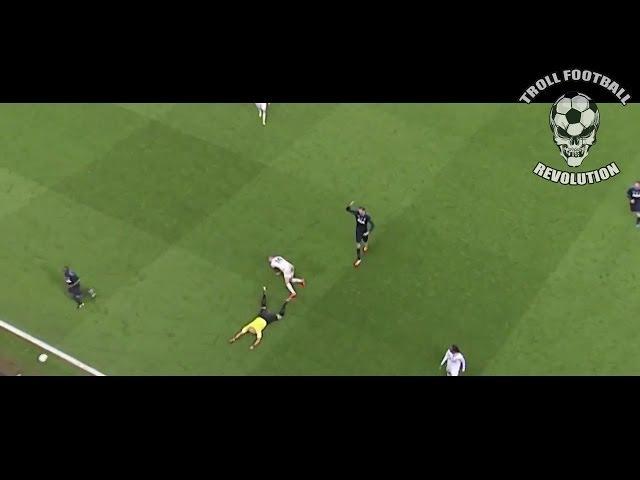 Howard Webb tackled by Lewis Holtby