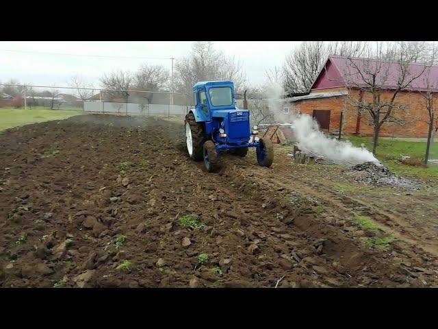 Plowing with a tractor t 40.  The best tractor for plowing the garden.