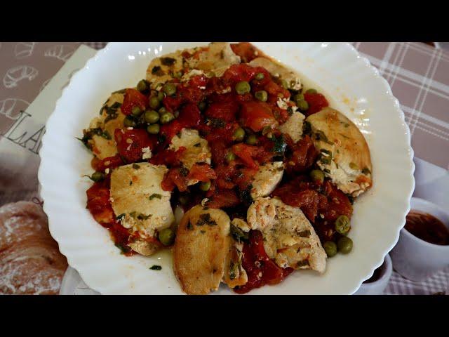 Stewed chicken breast with tomatoes and green peas. Fast and delicious