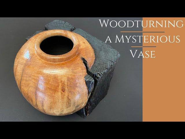 woodturning a mysterious vase in a cube of burnt oak