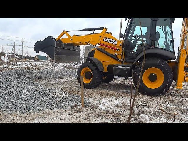 JCB Backhoe Collecting Gravel and Loading in Tractor. New tractor JCB 3CX - 2020