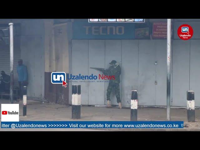 Watch a masked Police Officer shooting at Protesters in Nairobi CBD, one person shot dead