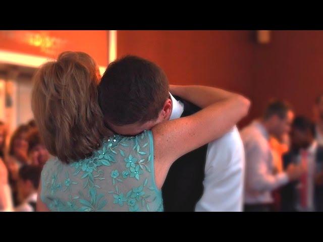 Groom Cries in His Mother's Arms at Wedding