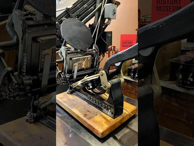 Printing the SHM logo and contact info on paper bags using a tabletop printing press