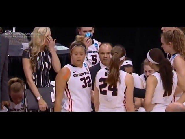 OSU coach getting dwarfed by his women basketball team during huddles