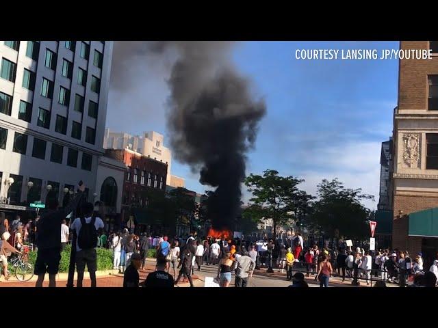 Cars overturned, fires set after day of protests in Lansing