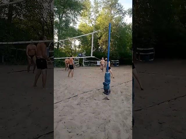 Beach volleyball, a sharp hit of the ball under the net.