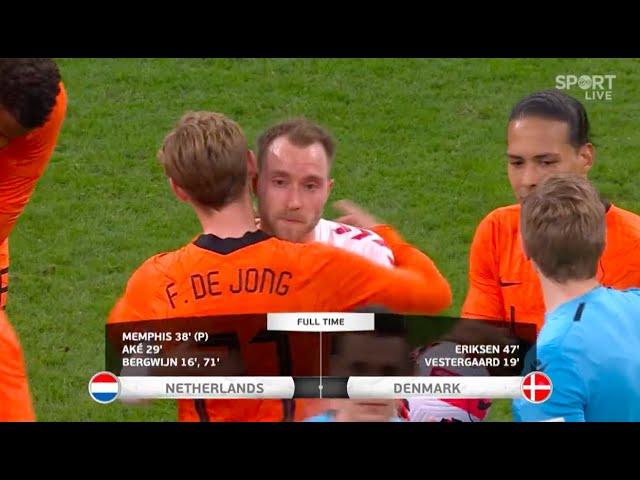 The Dutch and Danish players embrace Christian Eriksen after his brilliant return for Denmark.