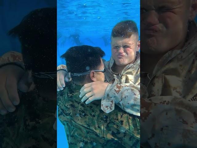 "DO NOT PANIC!" U.S. Marine Force Recon buddy rescue instructor demonstrates technique to student