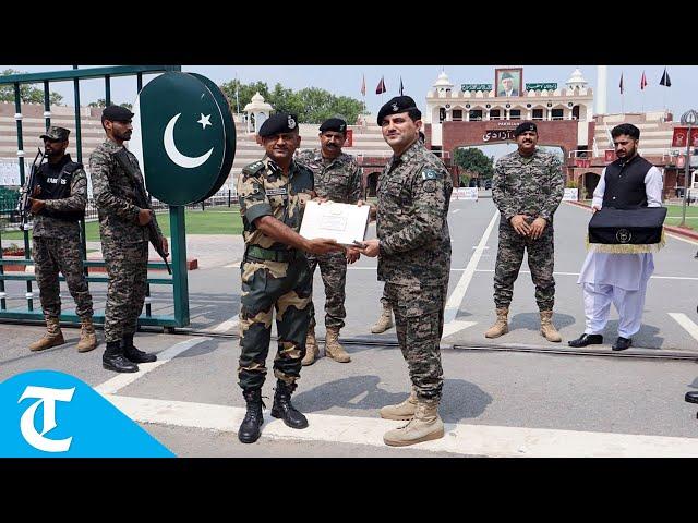 India's BSF, Pakistan Rangers exchange sweets at Attari-Wagah border in Amritsar on Eid-al-Adha