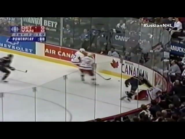 Ed Jovanovski welcomes Pavel Datsyuk to the NHL with a big boarding hit (6 oct 2001)