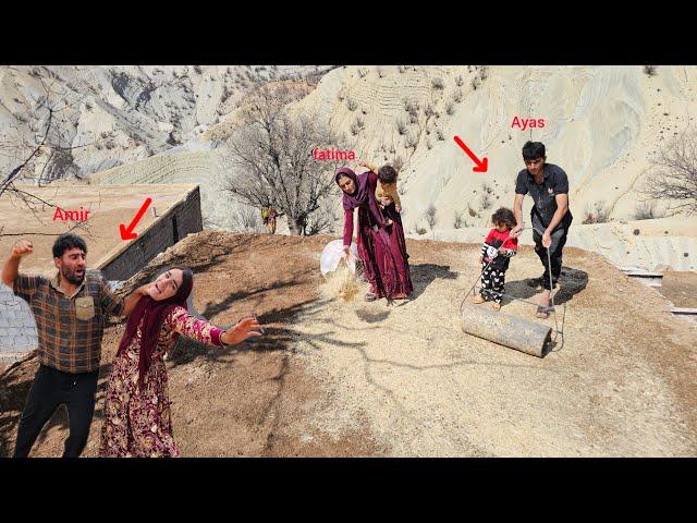 The industrious Ayas family: Fatima and Ayas finishing the roof of the house (Kohrig family)