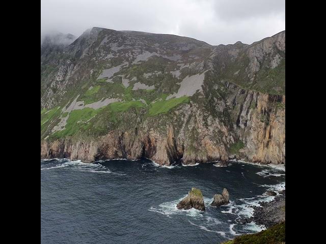 Sliabh Liag Cliffs with its upper reaches shrouded in fog, County Donegal, Ireland.