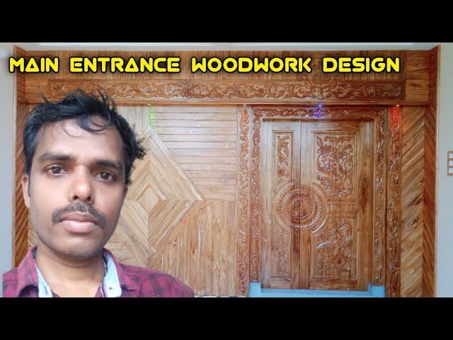 Main entrance woodwork design. hand calling work. modern house main entrance  ASV Haranadh HCW.