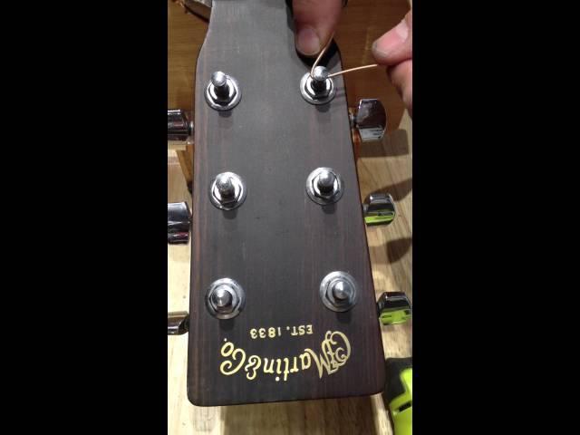 Stringing an acoustic or electric guitar