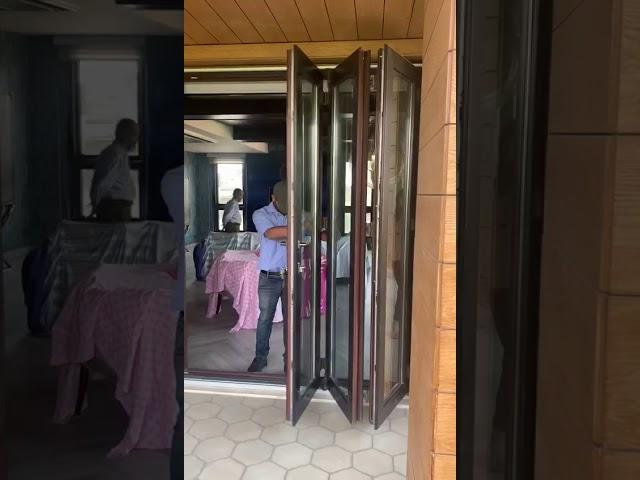 Fenesta Upvc slide and fold in black color with mesh system . Connect @9650792723
