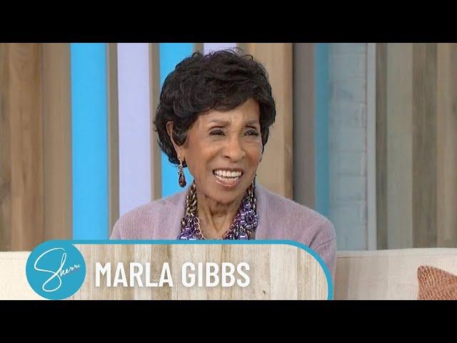 Sherri Gives Legend Marla Gibbs Her Flowers