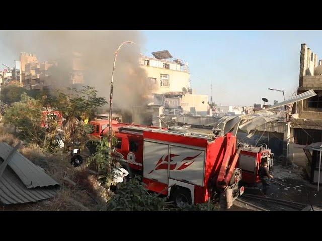 Emergency services at scene after 2 Israeli airstrikes hit Syria's capital and a suburb