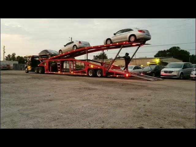 Miller Titan 7 car trailer getting unloaded