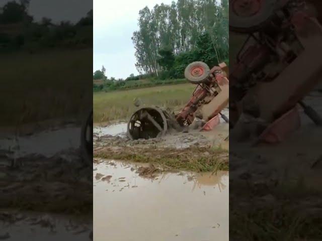village tractor stucked in loose mud