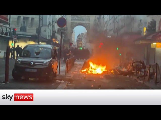 Protests break out in Paris after deadly triple shooting