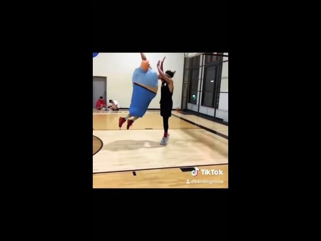 Fat guy dunks on basketball player 