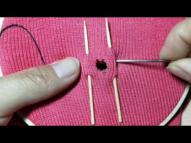 An interesting way to decoratively darn holes in clothes