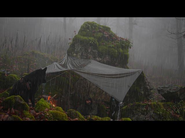 No tent, No sleeping bag - survival camping under rocks in a rainstorm