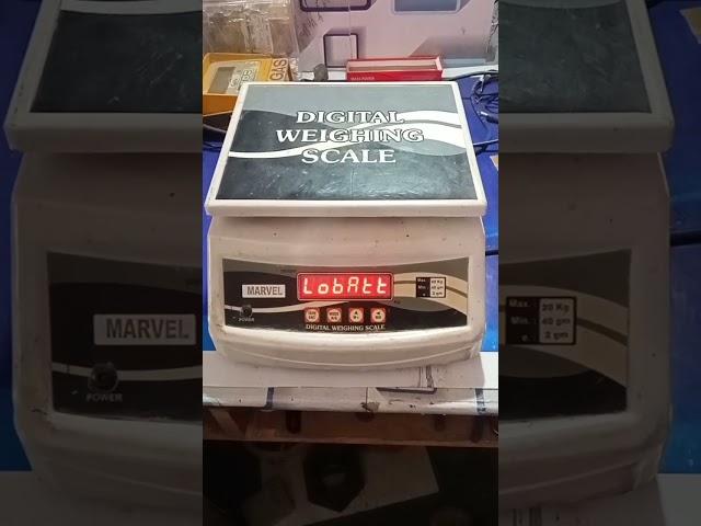 WEIGHING SCALE SHOWN LOBAT. SOLUTION