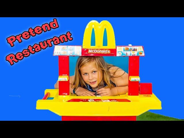 Assistant Operates a Pretend Drive Thru Restaurant