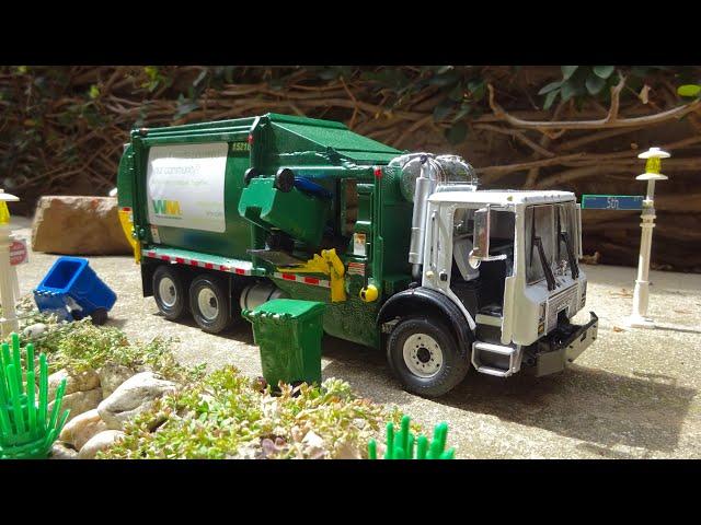 Custom Built 1:34 Scale First Gear Waste Management Trucks