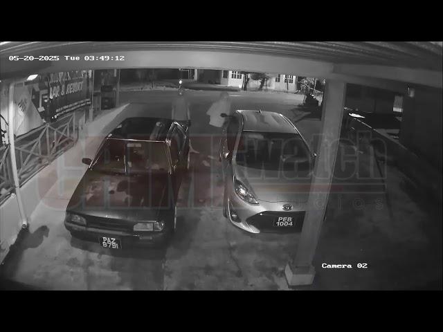 Bold face bandits: Suspect shifts camera upon noticing it.