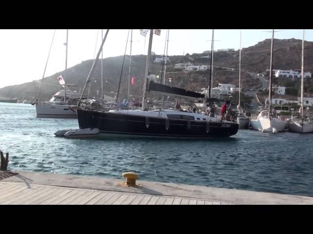 Successful sailboat docking in gusty wind (Mykonos)