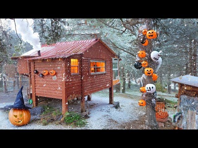 Halloween Celebration in a Wooden House in the Forest with Snow Falling