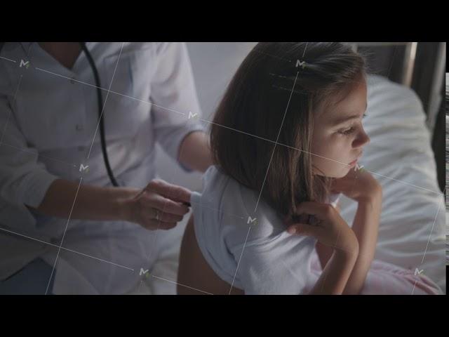 Attentive nurse listens breathing of a girl, using a phonendoscope