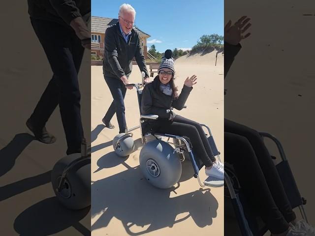 Rolling in a beach wheelchair at Ludington State Park on Lake Michigan ￼