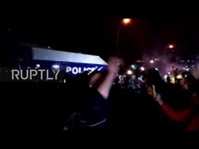 Georgia police disperse protesters with water cannons!