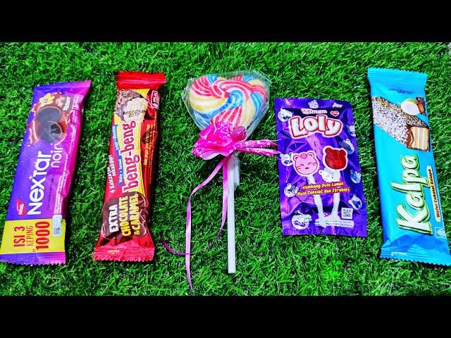 ASMR: Unboxing a 5 Giant Mystery Box Full of Candy chocolate rainbow lollipops Satisfying video