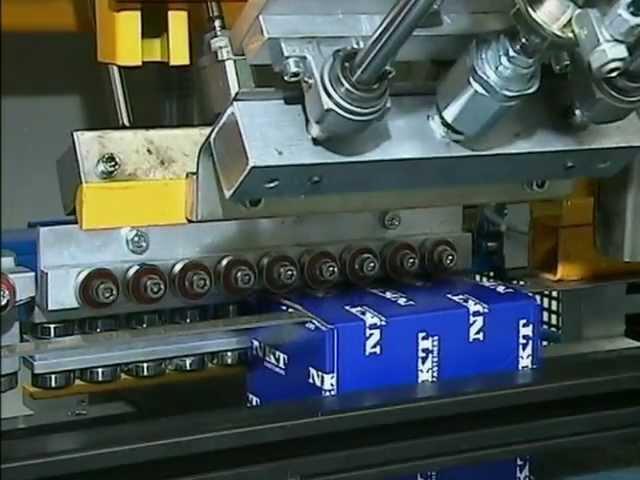 Weighpack Packaging Solutions - NKT Multihead packing line bolts and nuts into box.