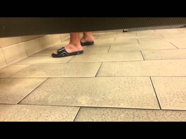 Candid restroom feet